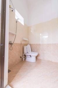 a bathroom with a toilet and a shower at HOI AN Meditation-2bed near old town in Hoi An