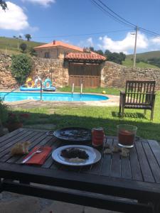 a table with a plate of food on top of it at Posada Venta Hornizo in Arenas de Iguña