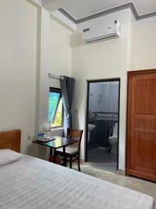 Postel nebo postele na pokoji v ubytování Hoàng Bách homestay