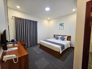 Ліжко або ліжка в номері Nimith Hotel & Restaurant