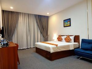 Ліжко або ліжка в номері Nimith Hotel & Restaurant