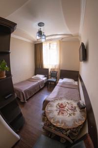 Postel nebo postele na pokoji v ubytování Parvana Hotel