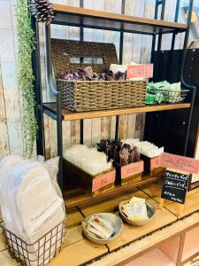 a display case with baskets and other items on a shelf at Apoa Hotel in Yokkaichi