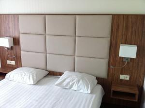 Postel nebo postele na pokoji v ubytování Hotel Middelburg