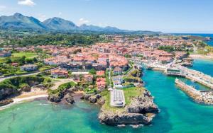 an aerial view of a small town on the ocean at Apartamento Boutique Arquera Golf II -Llanes in Llanes
