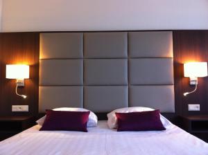 Postel nebo postele na pokoji v ubytování Hotel Middelburg