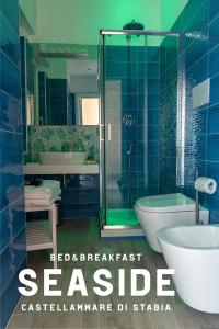 a bathroom with a shower and a toilet and a sink at B&B SEASIDE in Castellammare di Stabia