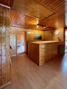 a large room with wooden walls and a wooden floor at ”Heimet” im Berner Oberland in Unterbach