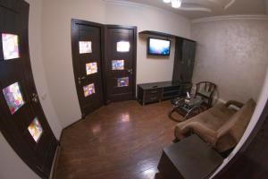 a living room with a couch and a table at Parvana Hotel in Gyumri