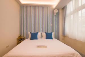 Letto o letti in una camera di One Heart Inn
