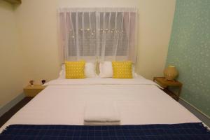 Letto o letti in una camera di One Heart Inn