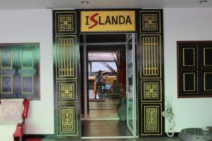 an entrance to a building with a sign on the door at Islanda Hotel Patong in Patong Beach