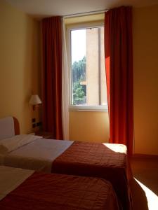 En eller flere senge i et værelse på Albergo Italia
