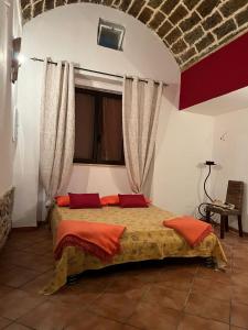 Katil atau katil-katil dalam bilik di Casa vacanza Castello