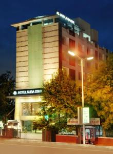 a hotel with a sign on top of a building at Hotel Suba Star Ahmedabad in Ahmedabad