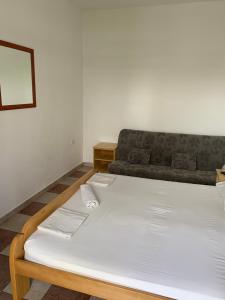 Postel nebo postele na pokoji v ubytování Anita Guest House