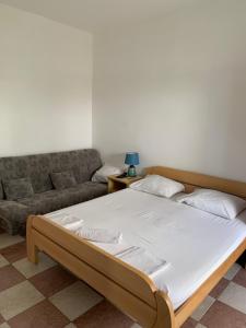 Postel nebo postele na pokoji v ubytování Anita Guest House