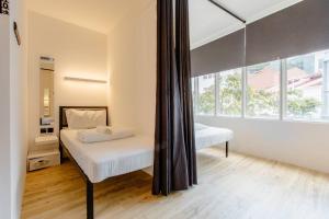 Postel nebo postele na pokoji v ubytování RadZone Hostel