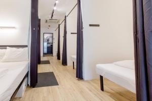 Postel nebo postele na pokoji v ubytování RadZone Hostel