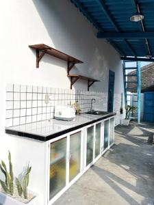 a kitchen with a counter with a toaster on it at QiHome Phú Quý in Cu Lao Thu