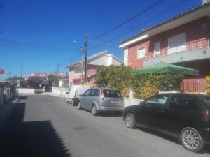 a group of cars parked on the side of a street at River City House 