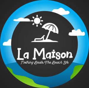 a logo for a beach with a chair and an umbrella at La Maison Guesthouse in Manlocahoc