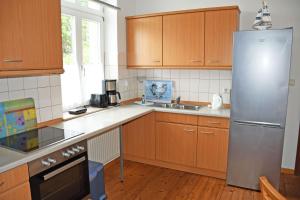 Kuchyň nebo kuchyňský kout v ubytování ruhig gelegenes Appartementhaus mit Balkon SA