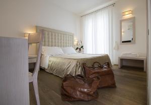 Postel nebo postele na pokoji v ubytování Hotel Alta La Vista