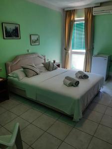 Postel nebo postele na pokoji v ubytování Guest House Aldin