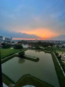 an aerial view of a large body of water at sunset at MyNest1103A@SweetHome in Melaka
