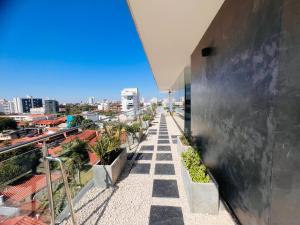 a balcony of a building with a view of a city at Departamento 2do y 3er anillo in Santa Cruz de la Sierra