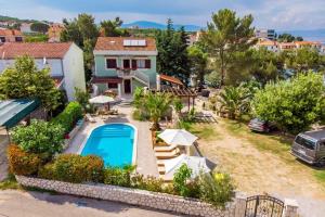 an aerial view of a house with a swimming pool at House Dinka with Pool in Porat