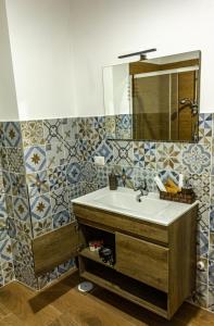 a bathroom with a sink and a mirror at INCASTRO B&B IN CROTONE in Crotone