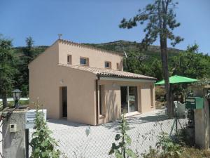 a house with a fence in front of it at Villa neuve piscine chauffée - St Vallier de Thiey in Saint-Vallier-de-Thiey