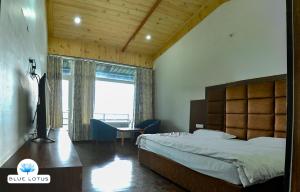 Postel nebo postele na pokoji v ubytování Blue Lotus Resort