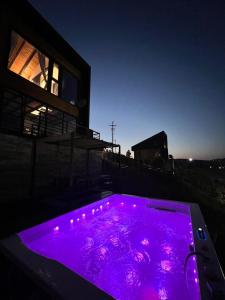 a purple pool with lights on top of a building at Zlatibor Wild nest Rabbit in Zlatibor