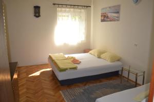 Postel nebo postele na pokoji v ubytování Apartments Milosevic