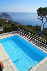 a swimming pool with a view of the ocean at Sea View Sirolo di Amedeo in Sirolo
