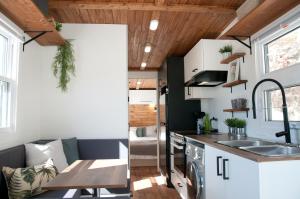 a kitchen with a sink and a counter top at Chalets Didoche in Havre-Saint-Pierre