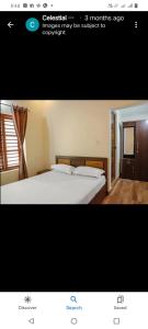 a picture of a bedroom with a large bed at Celestial Homestay in Wayanad