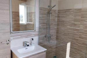 a bathroom with a sink and a shower at Casa Anna, Lecrin, Granada in Granada