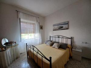 a bedroom with a bed and a window at A casa di Pissi - apartment in Ravello