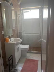 Koupelna v ubytování Apartment Centar + 14 fotografií