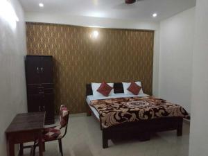 Кровать или кровати в номере Spot ON HOME 81265 Hotel Sitasmriti