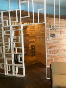 a room with two bunk beds and a couch at Surfer's Cafe& Hostel in Chatan