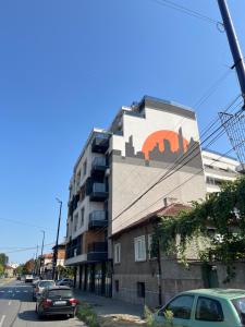 a building with a mural on the side of it at Ultra Lux Apartment Free Underground Secure Parking in Pazardzhik