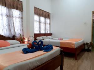 Postel nebo postele na pokoji v ubytování Subash Hotel