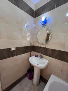 Vonios kambarys apgyvendinimo įstaigoje Raheem Hosting House Shared rooms