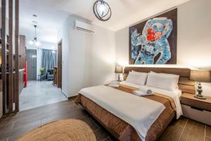 Postel nebo postele na pokoji v ubytování Anna Suites