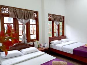 Postel nebo postele na pokoji v ubytování Subash Hotel